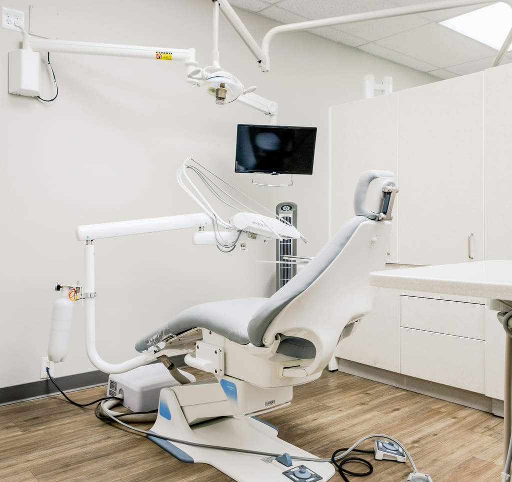 Modern dental treatment room with a dental chair